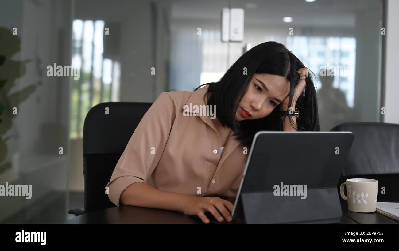 Serious Businesswoman Holding Head And Feeling Tired After Unproductive Work Stock Photo Alamy