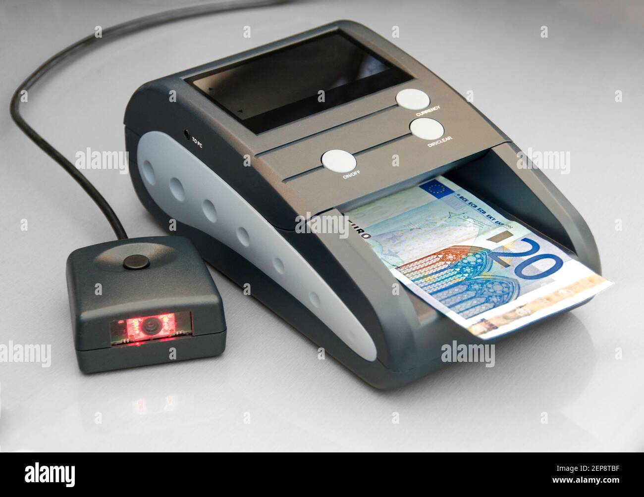 checker device for fake money Stock Photo - Alamy