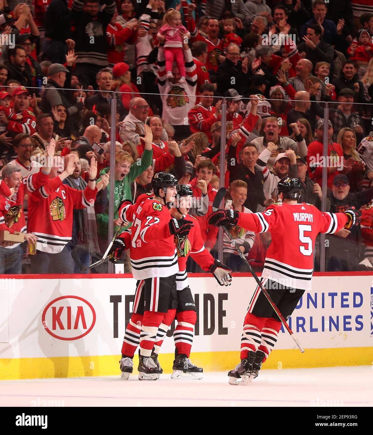 Chicago Blackhawks center Kirby Dach, right, celebrates his tying