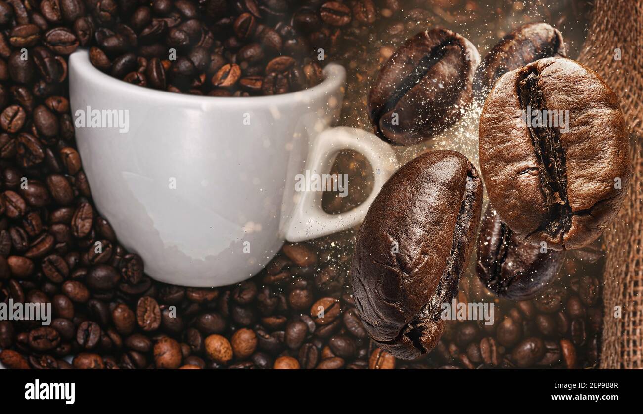 background with coffee beans falling on a cup of coffee Stock Photo - Alamy