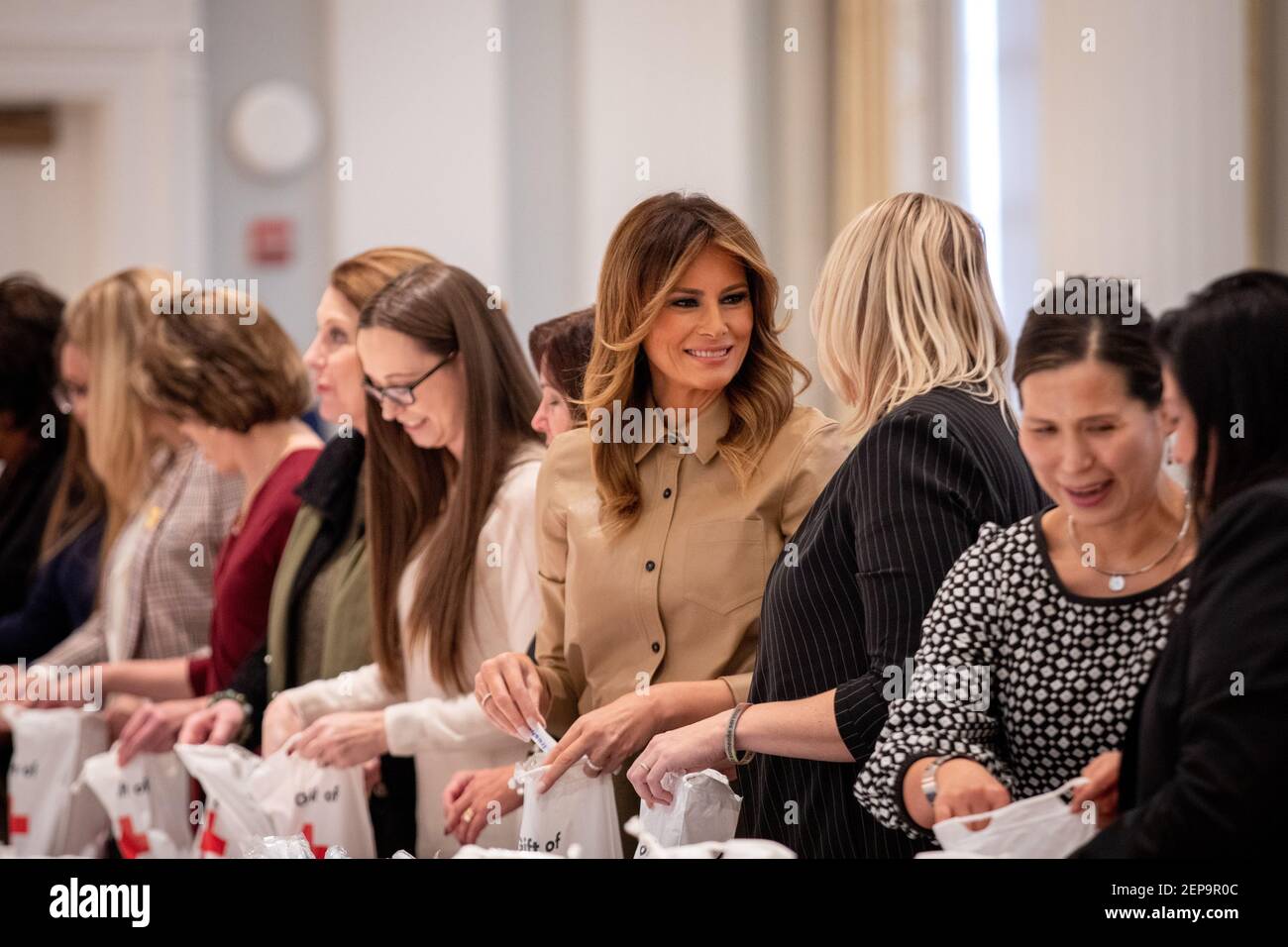 First Lady of the United States Melania Trump builds comfort kits for US  troops stationed in Poland, Romania, Djibouti, Iraq and Kuwait at the The  American Red Cross national headquarters in Washington,