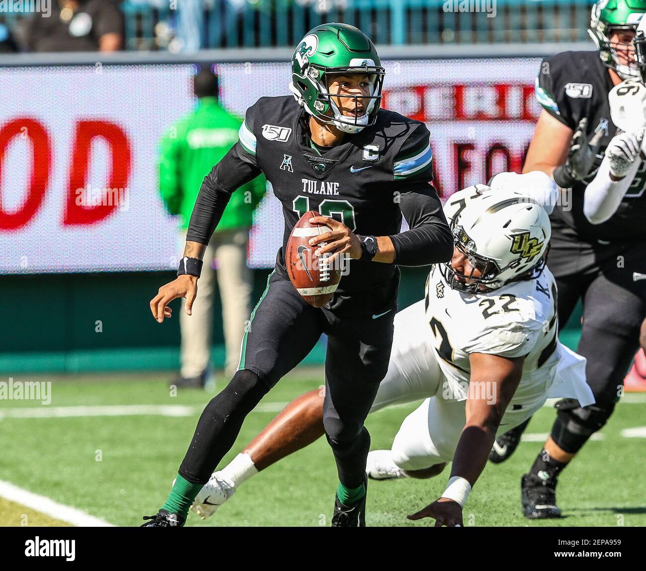November 23, 2019: Tulane QB Justin McMillan #12 escapes from a UCF pass rusher by leaving the pocket during the NCAA football game between the Tulane Green Wave and the UCF Knights at Yulman Stadium in New Orleans, LA. Kyle Okita/(Photo by Kyle Okita/CSM/Sipa USA) Stock Photo