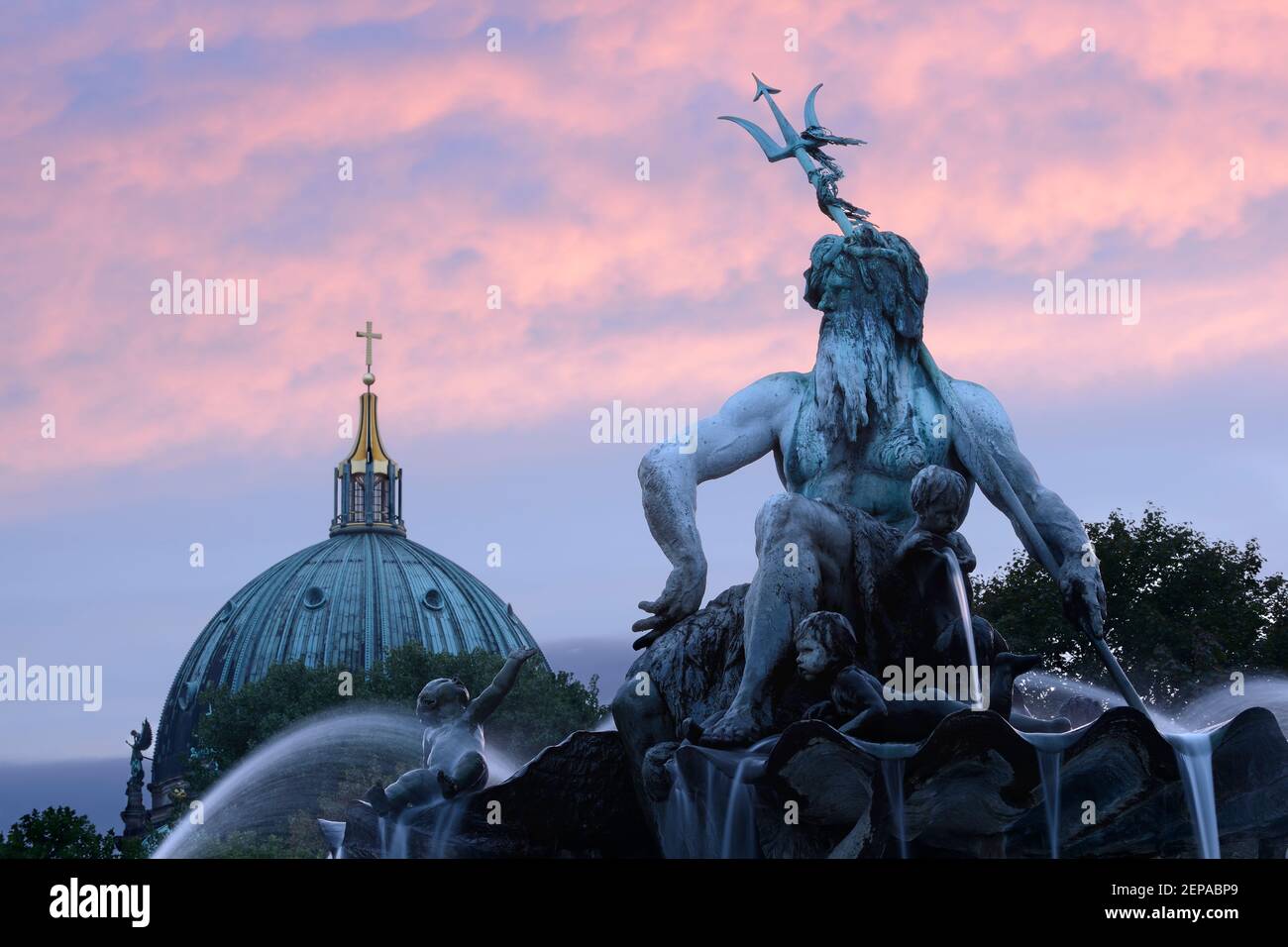 The Nepture Fountain with the dome of the Berliner Dom in the distance. Berlin, Germany. Stock Photo