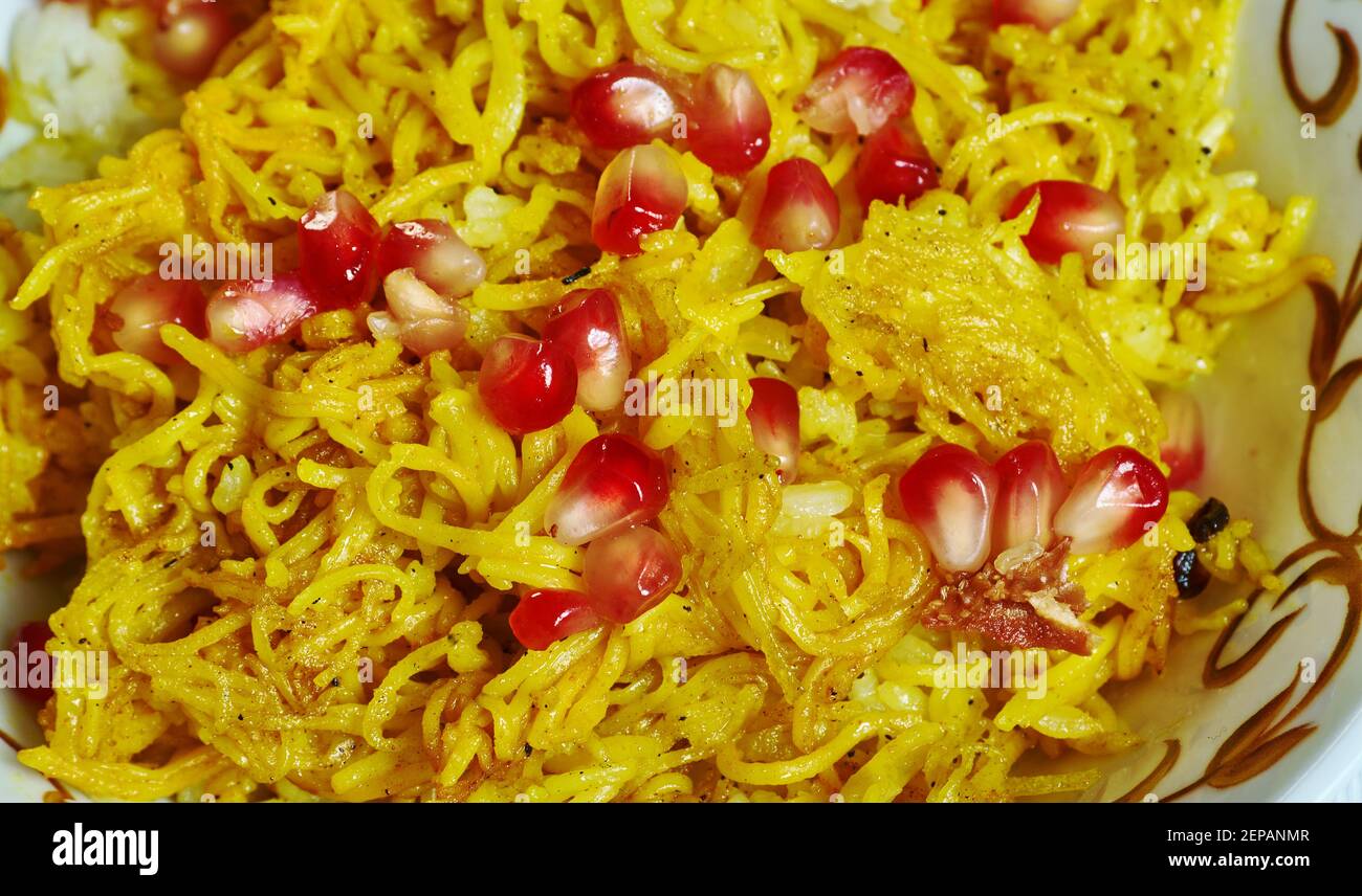 Amiri Khaman with pomegranate, fresh coconut, coriander leaves
