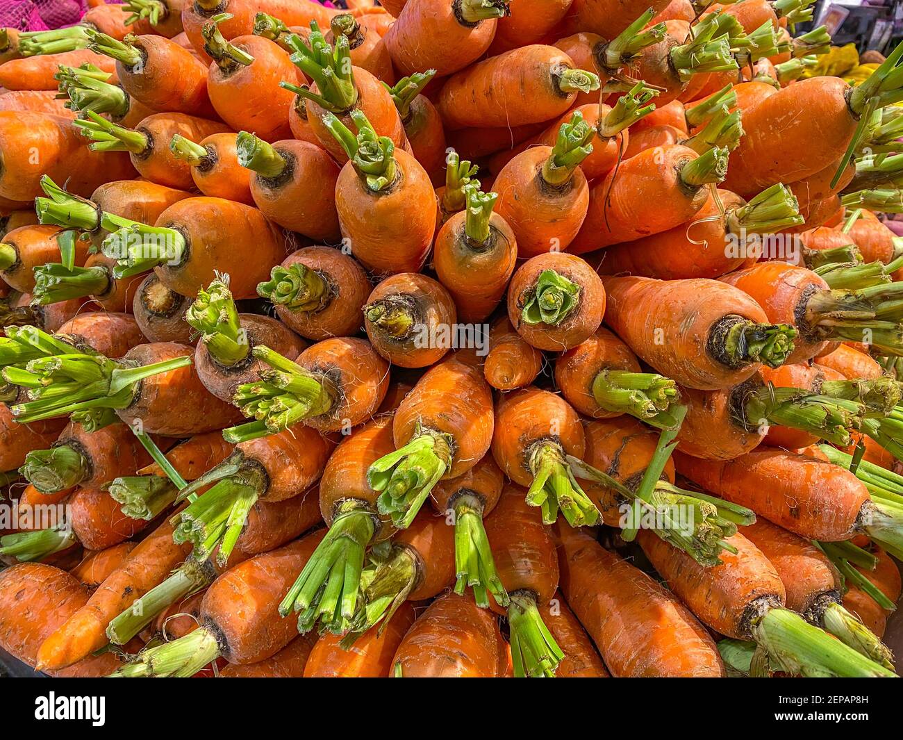 Pile of fresh carrots for sale at supermarket Stock Photo Alamy