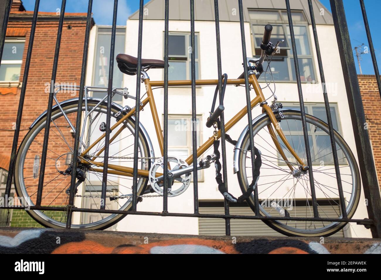 Bicycle chained to railing in urban environment, London, England. Stock Photo