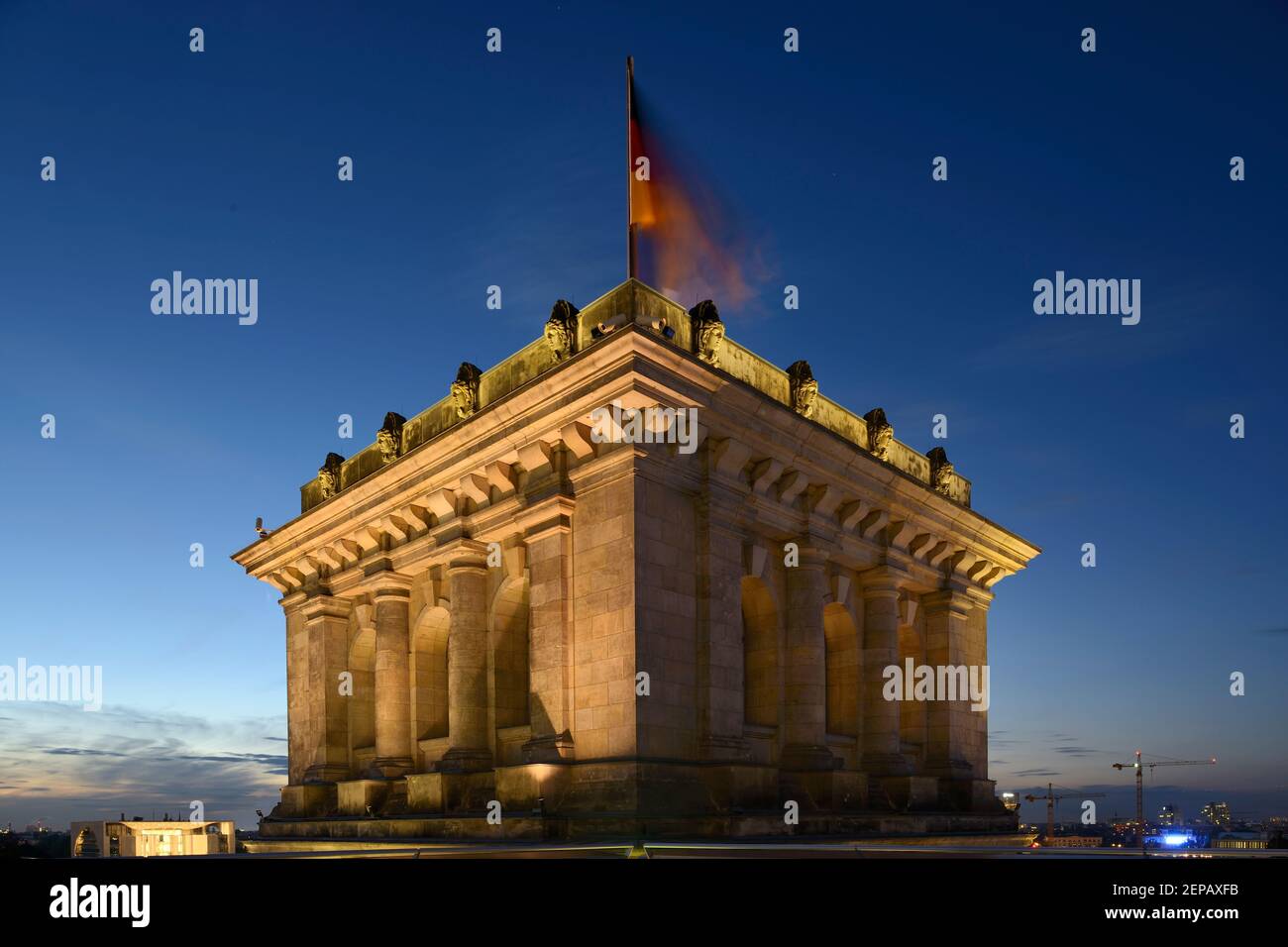 A German flag flying on a corner of the Reichstag building in Berlin, Germany. Stock Photo