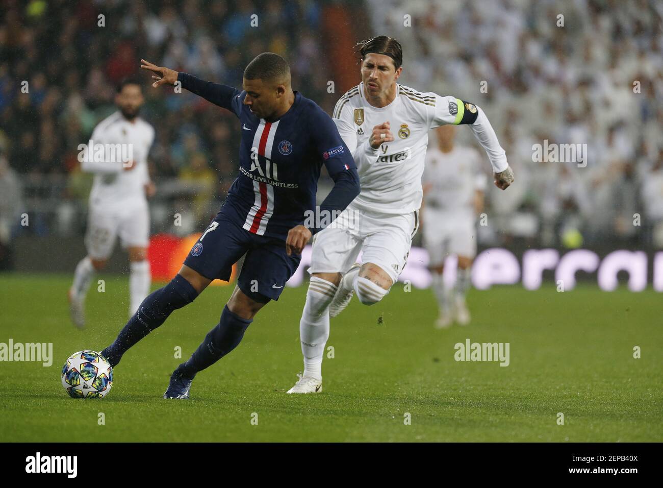 Kylian Mbappe of PSG and Real Madrid CFs Sergio Ramos are seen in action during the UEFA Champions League match, between Real Madrid and Paris Saint Germain at Santiago Bernabeu Stadium in