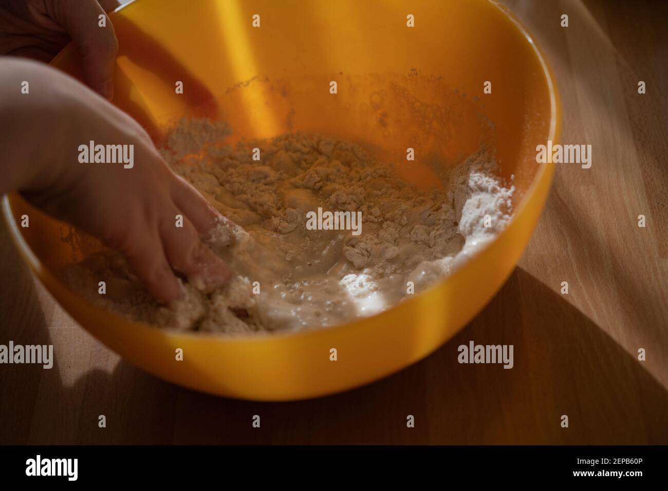 Woman mixing flour and water to make a dough Stock Photo Alamy