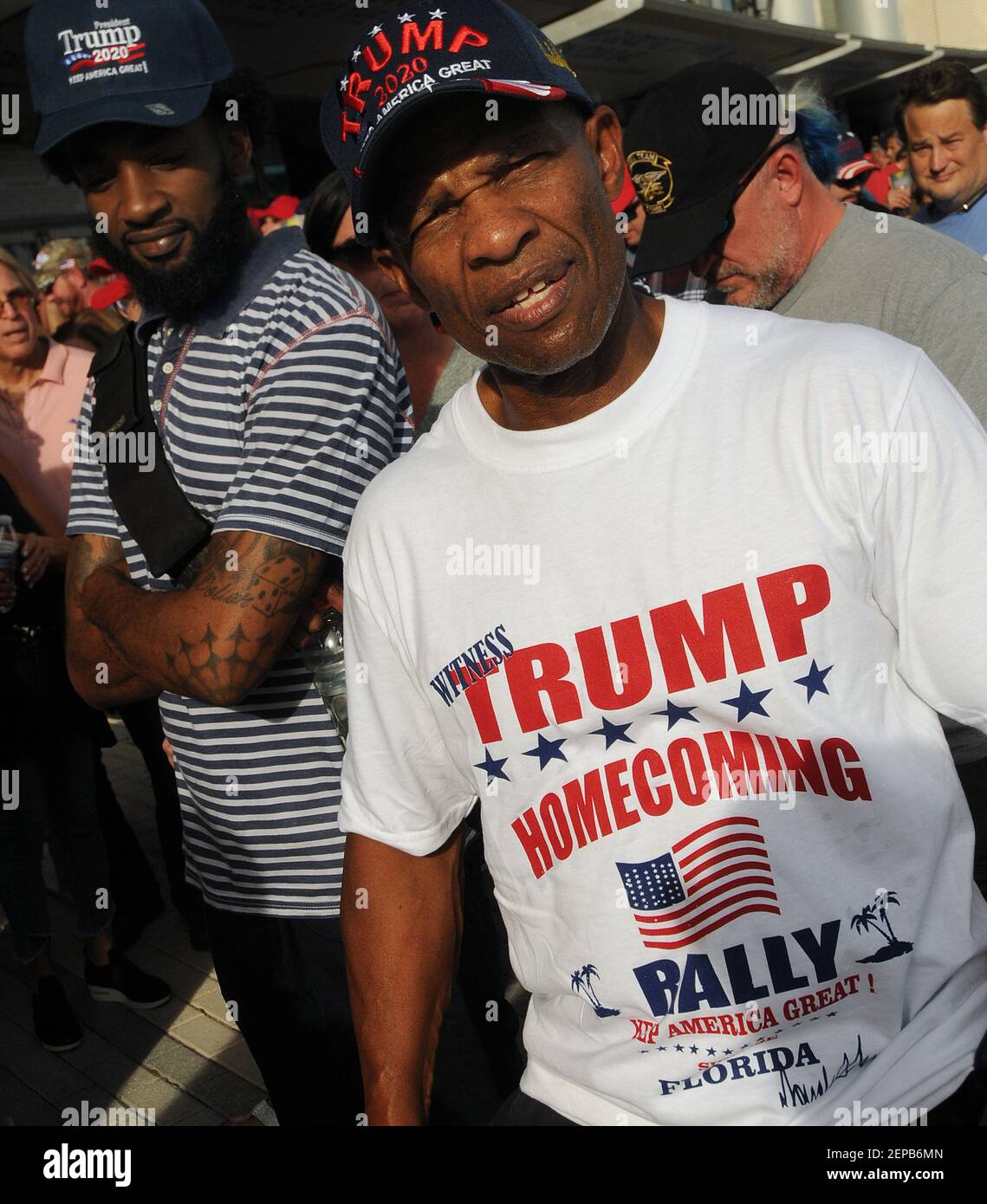 People wait in a line to hear U.S. President Donald Trump speak during ...