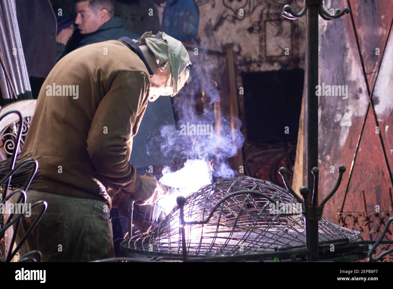 MARRAKESH, MOROCCO - NOVEMBER 21; 2018  metal worker welding in the medina Stock Photo