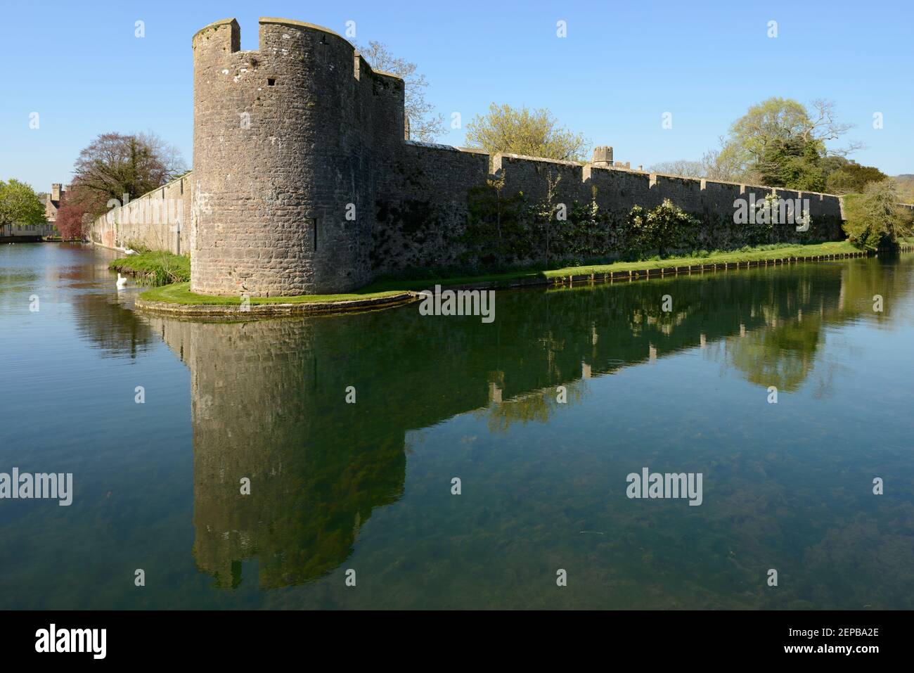The moat and wall of the Bishop's Palace in the city of Wells, Somerset. Stock Photo