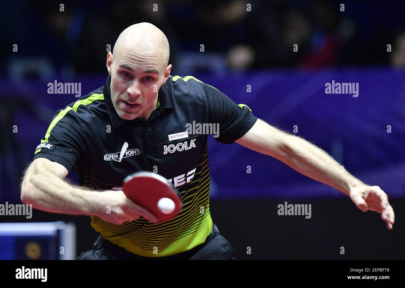 Daniel Habesohn of Austria returns a shot against Dimitrij Ovtcharov of  Germany in their Men's Singles Group A match during the 2019 ITTF Men's  World Cup in Chengdu City, southwest China's Sichuan