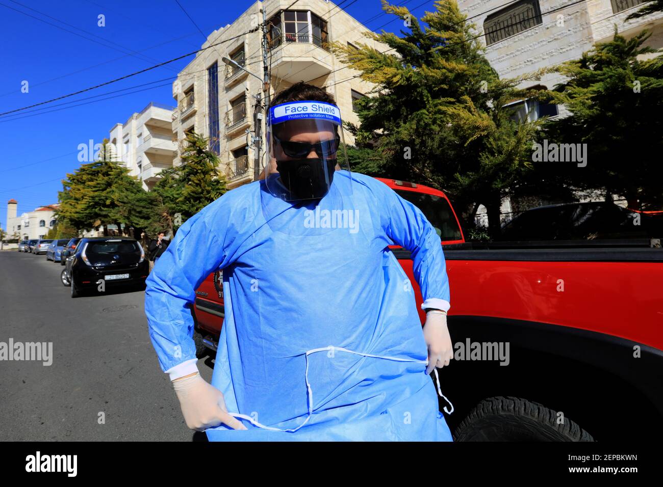 210227) -- AMMAN, Feb. 27, (Xinhua) -- A health worker prepares to collect samples for COVID-19 tests in Amman, Jordan, Feb. 26, 2021. Jordan on Wednesday to reinstate curfew on