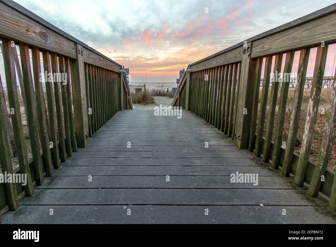 Boardwalk path to a sunrise beach on the coast of the Atlantic Ocean in Myrtle Beach, South Carolina Stock Photo
