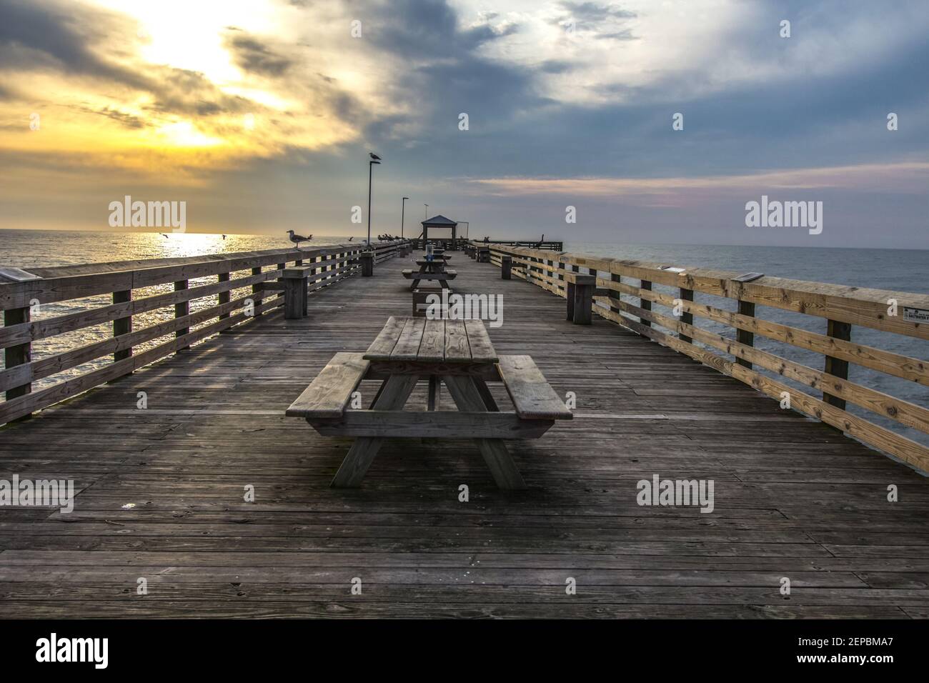Fishing pier at dawn on the Atlantic Ocean coast in Myrtle Beach, South Carolina Stock Photo