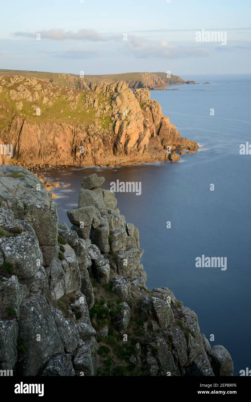 Sunset along a stretch of coastal cliff at Pordenack Point, Land's End, Cornwall. Stock Photo