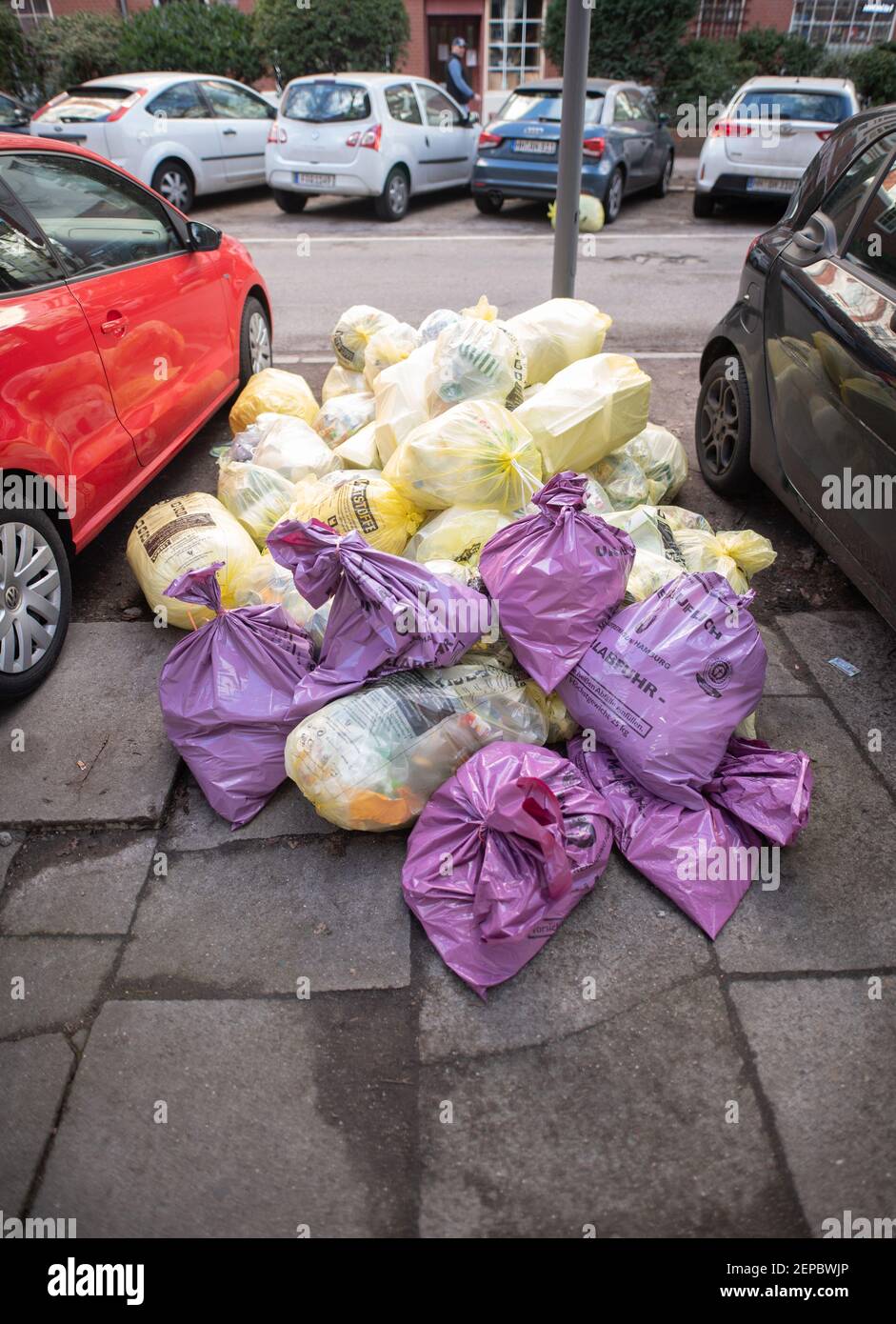 Hamburg, Germany. 26th Feb, 2021. Numerous garbage bags lie between