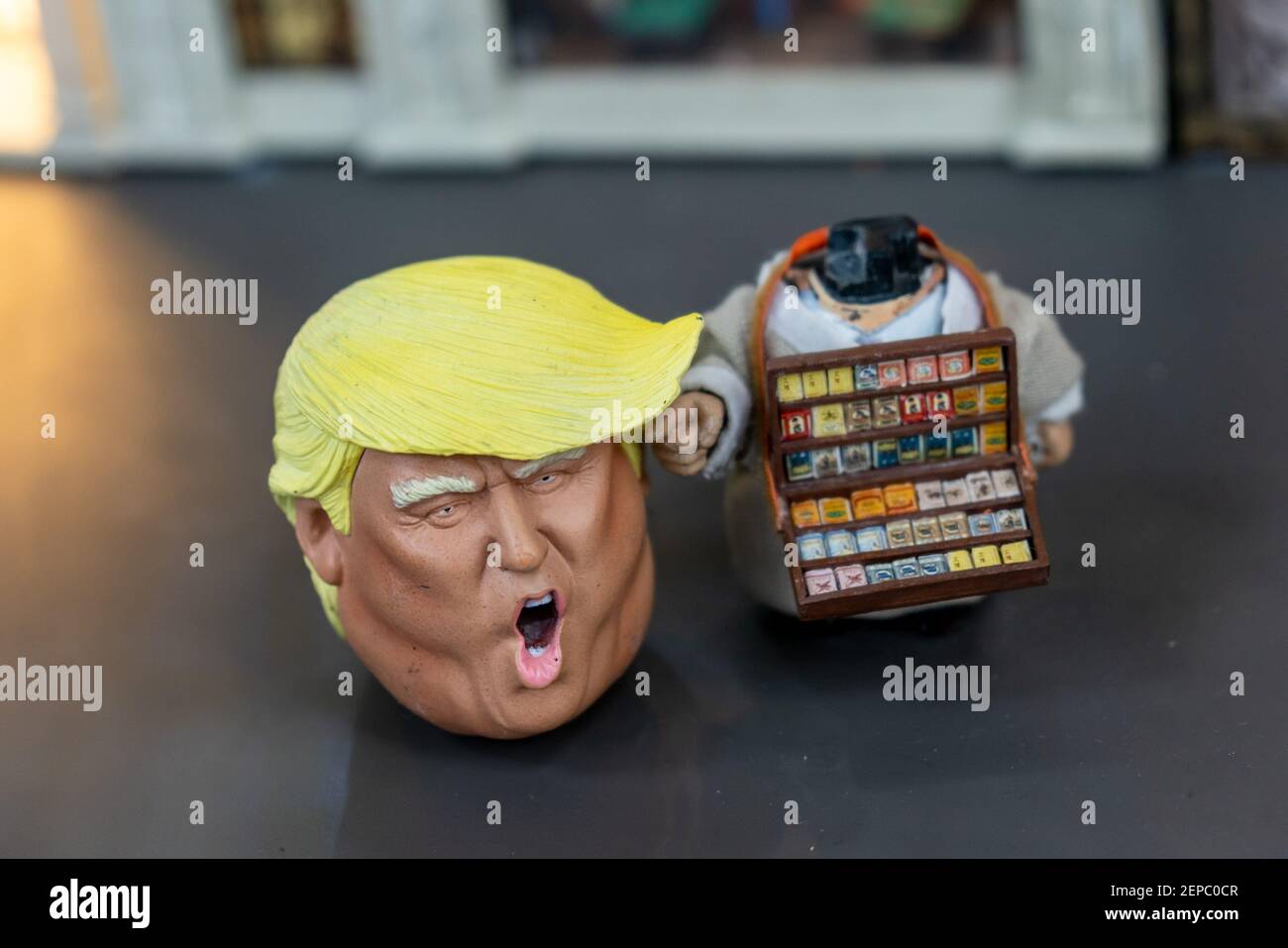 A wacky miniature of American president Donald Trump selling cigarettes and  Japanese prime minister Shinzo Abe selling pop corns on the street were pr  Stock Photo - Alamy
