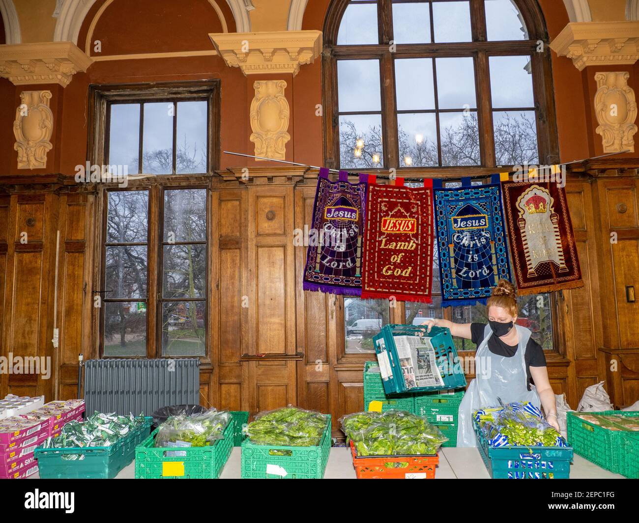 A volunteer at The Community Food Hub at Tottenham Town Hall in London. Doors are open several days a week to some of the hardest hit by Coronavirus. Stock Photo