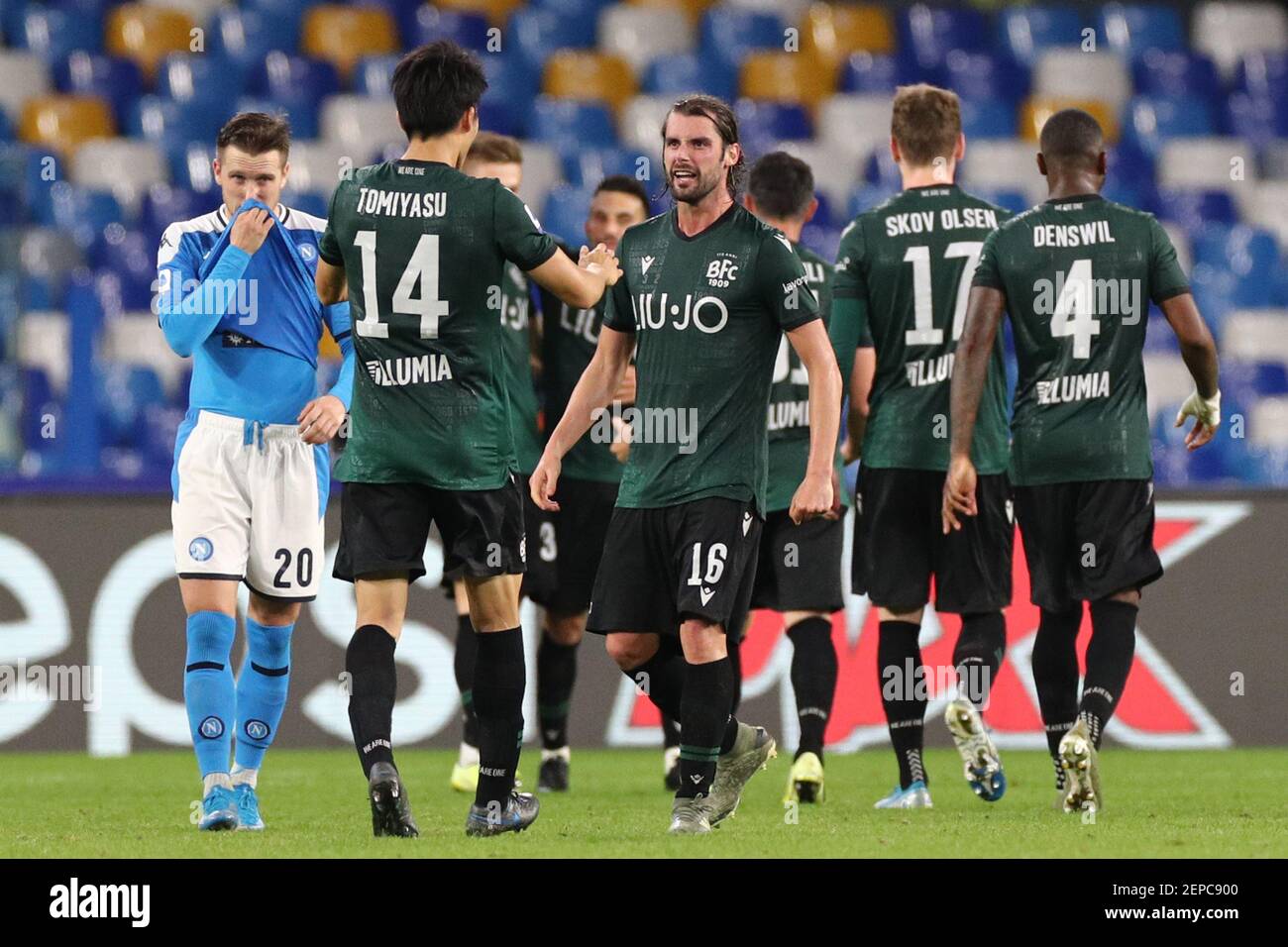 Takehiro Tomiyasu of Bologna and Andrea Poli celebrate at the end of the  match Napoli 01-