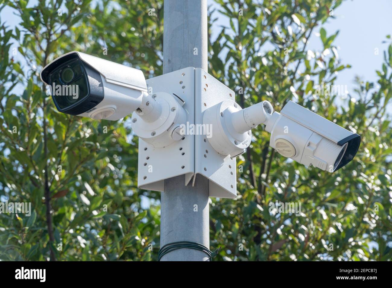 Security systems and alarm technology concept CCTV camera hanging on