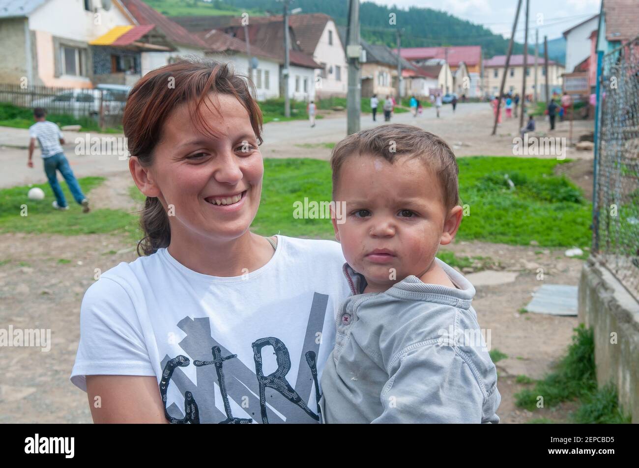 Lomnicka, Slovakia. 05-16-2018. Roma or Gypsy mother with child in a abandoned community in the heart of Slovakia, living in miserable conditions. Stock Photo
