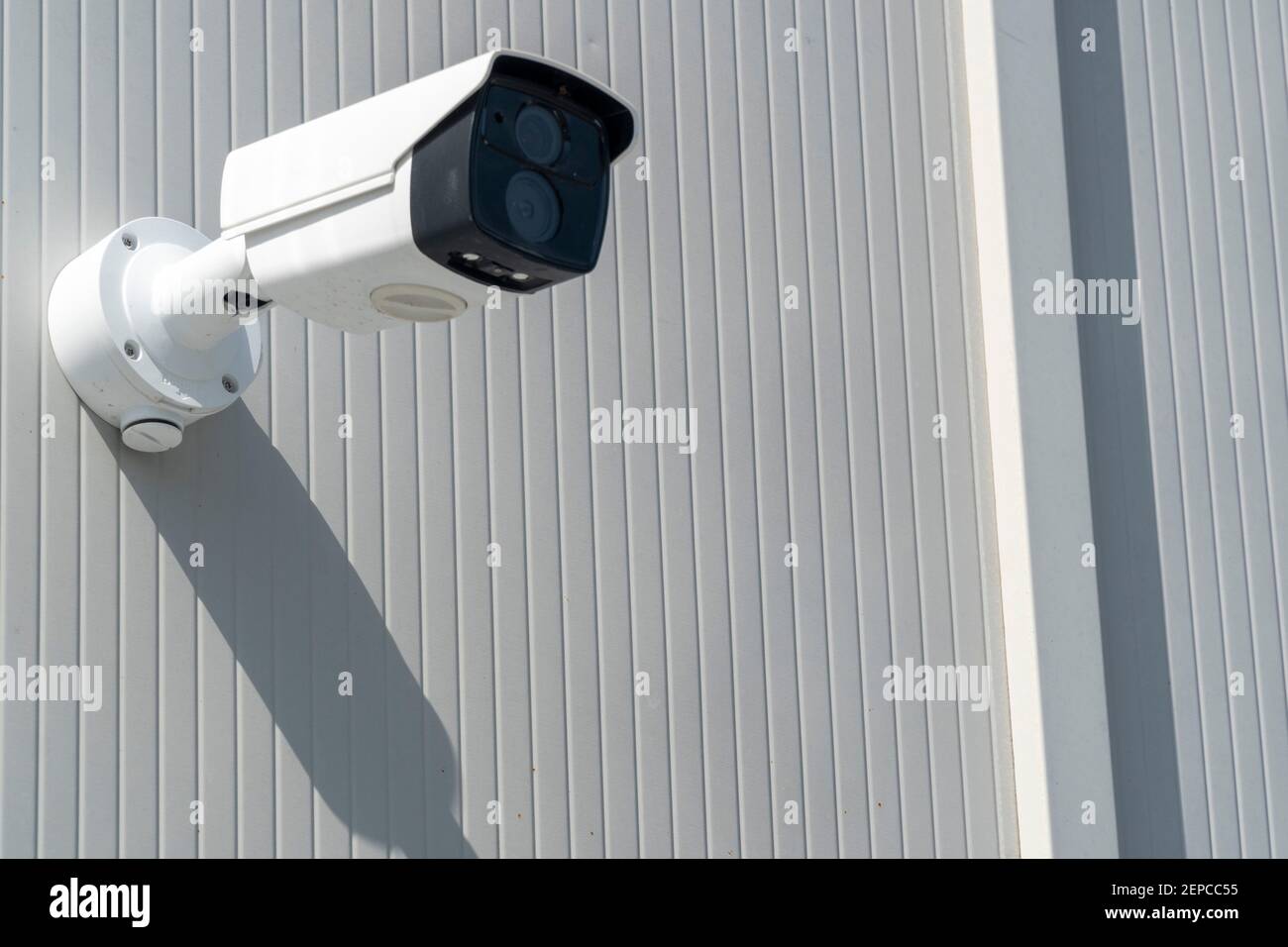Security systems and alarm technology concept CCTV camera hanging on