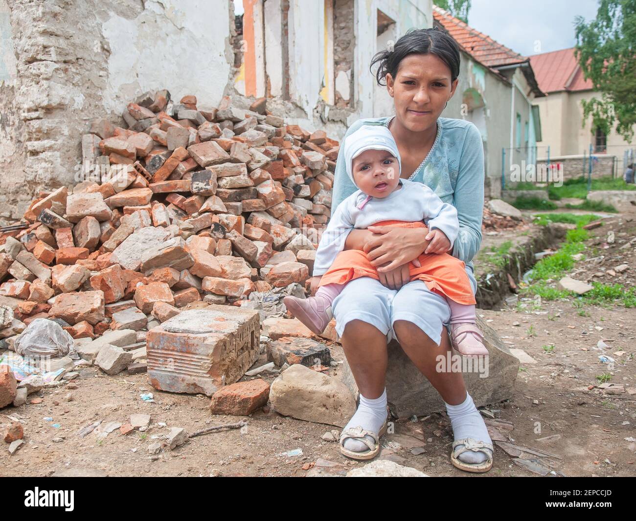 Lomnicka, Slovakia. 05-16-2018. Gypsy mother and daughter living in misery and poverty in a abandoned Roma community in the heart of Slovakia. Stock Photo