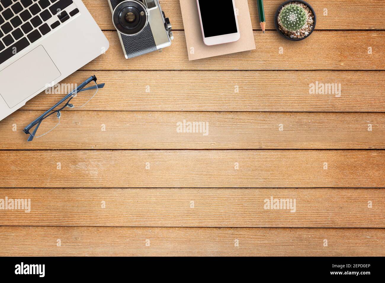 Office desk table with office equipment on wooden table background
