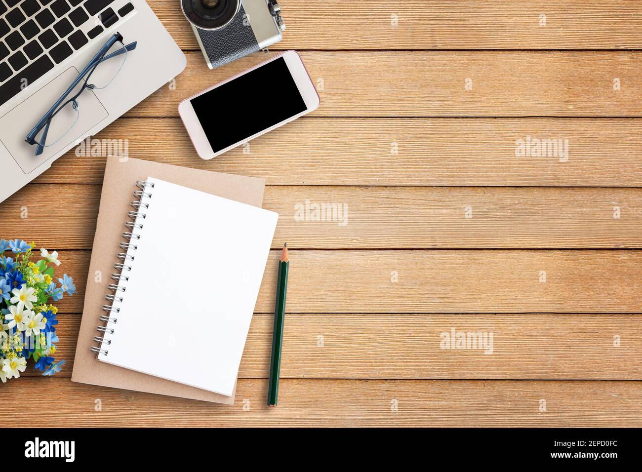 Office desk table with office equipment on wooden table background
