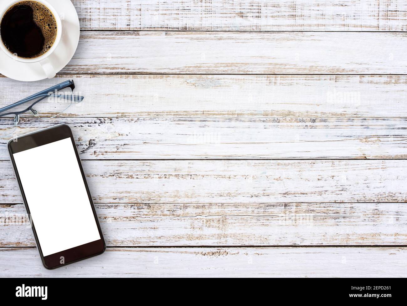 Smart phone with blank screen area and coffee cup on vintage wooden ...