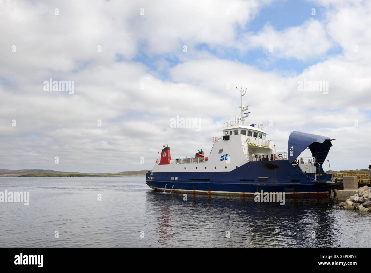A ferry waiting to load cars for transport between the islands of Yell and Unst, Shetland. Stock Photo