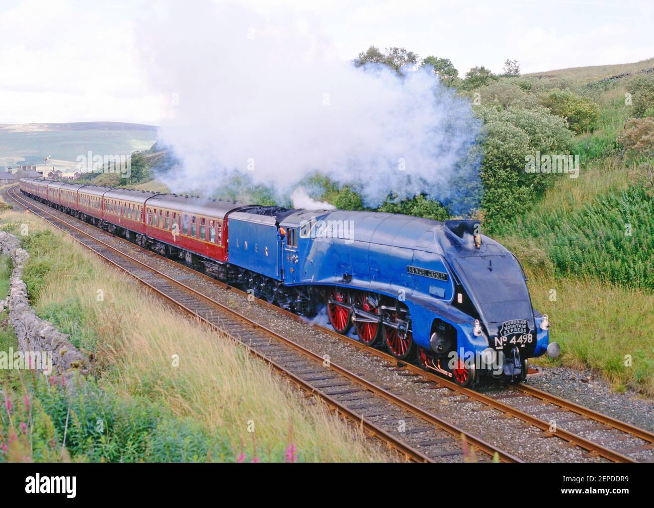 A4 Pacific No 4498 Sir Nigel Gresley leaving Garsdale, Settle to Carlsile Railway, England Stock Photo