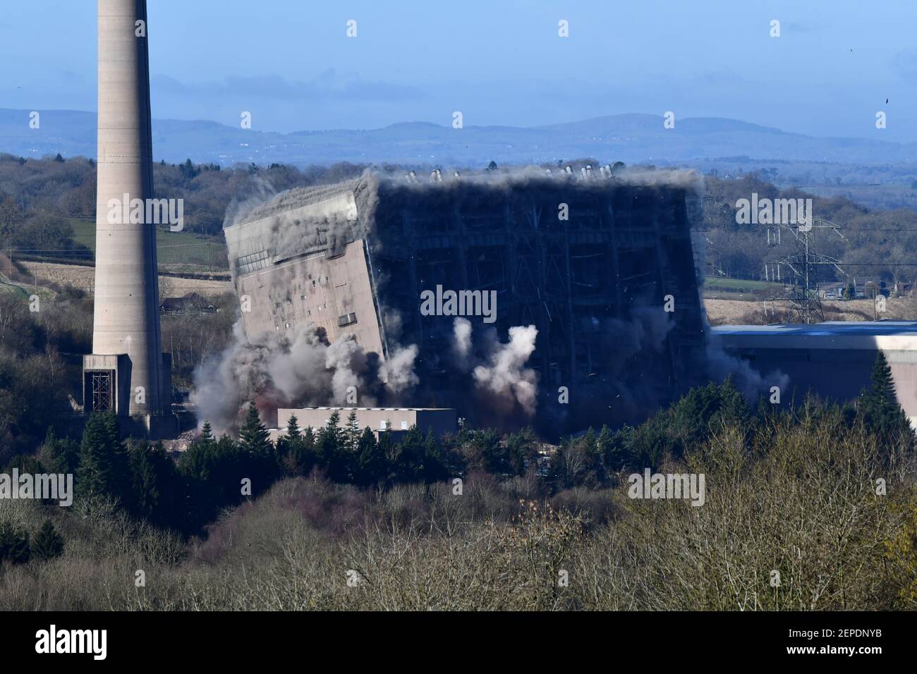 Buildwas, Shropshire, Uk. February 27th 2021 Buildwas Power Station demolished with high explosives. Another one bites the dust! The huge generating hall at Buildwas Power Station near Ironbridge in Shropshire is brought to it's knees by by demolition contractors. Credit: Dave Bagnall/Alamy Live News Stock Photo