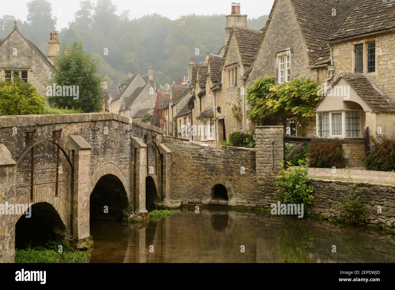 The bridge and High Street in Castle Combe, Wiltshire. Stock Photo