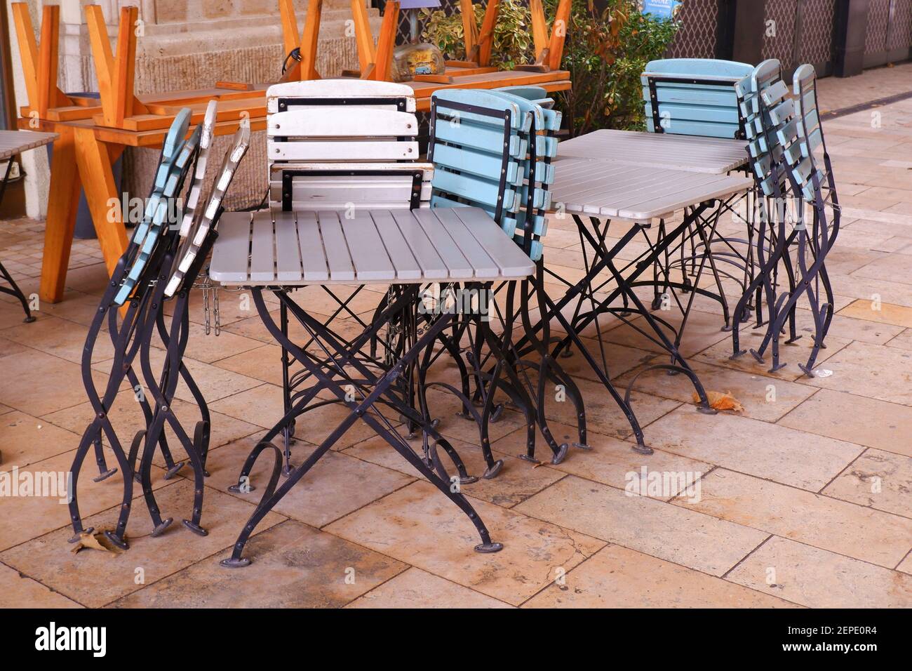 Closed cafe terrace restaurant due to coronavirus pandemic with folded  chairs and tables in Budapest downtown, Hungary Stock Photo - Alamy