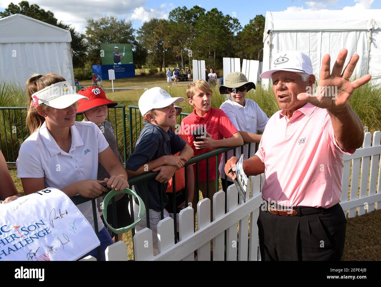 Lee Trevino signs autographs for his fans after competing in the PNC Father  Son Challenge golf tournament at the Ritz-Carlton Golf Club in Orlando.  Trevino was paired with his grandson, Daniel Trevino. (