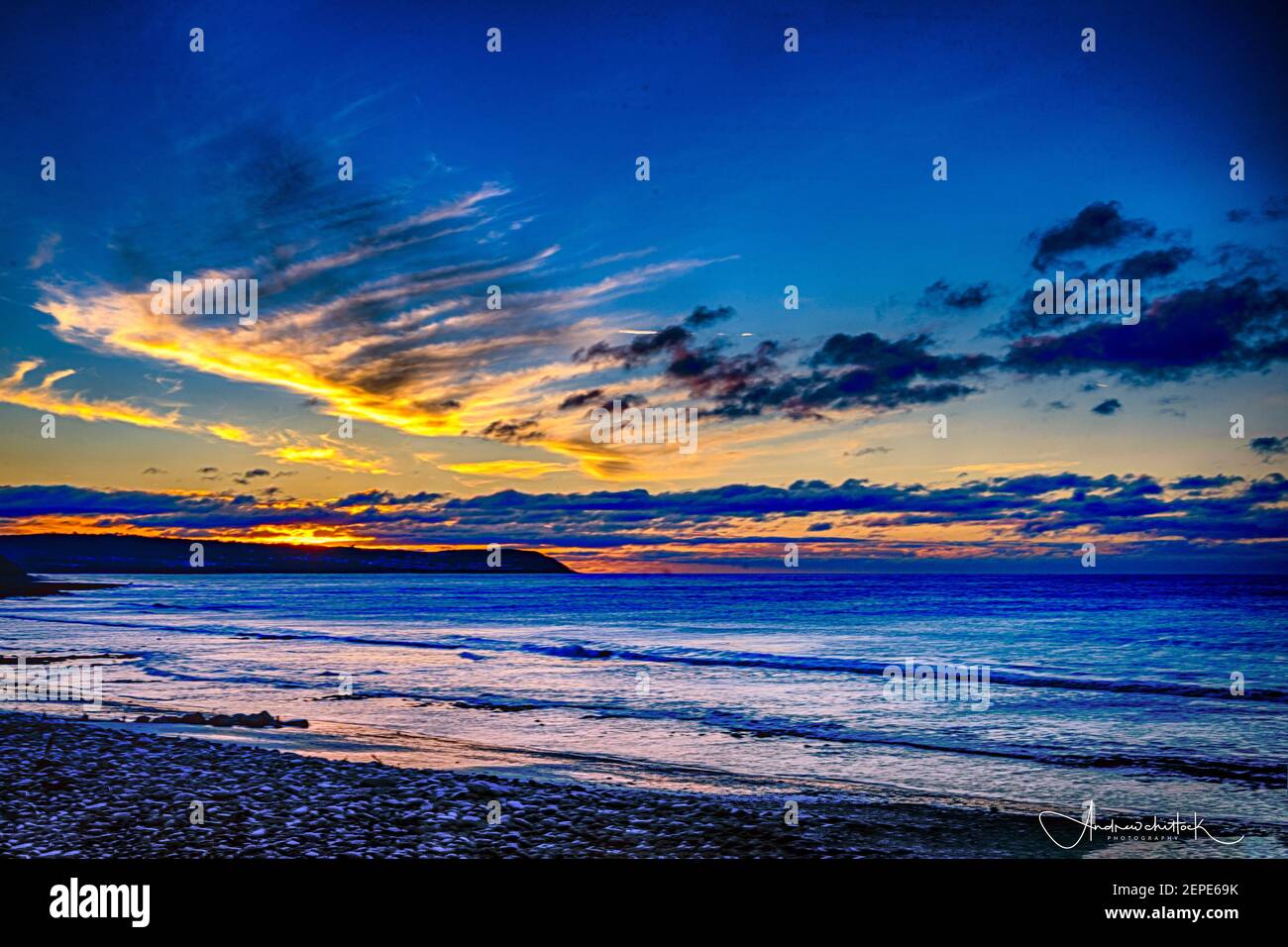© Licensed to Andrew Chittock 27/02/2021 sunset south beach aberaeron west Wales uk Stock Photo