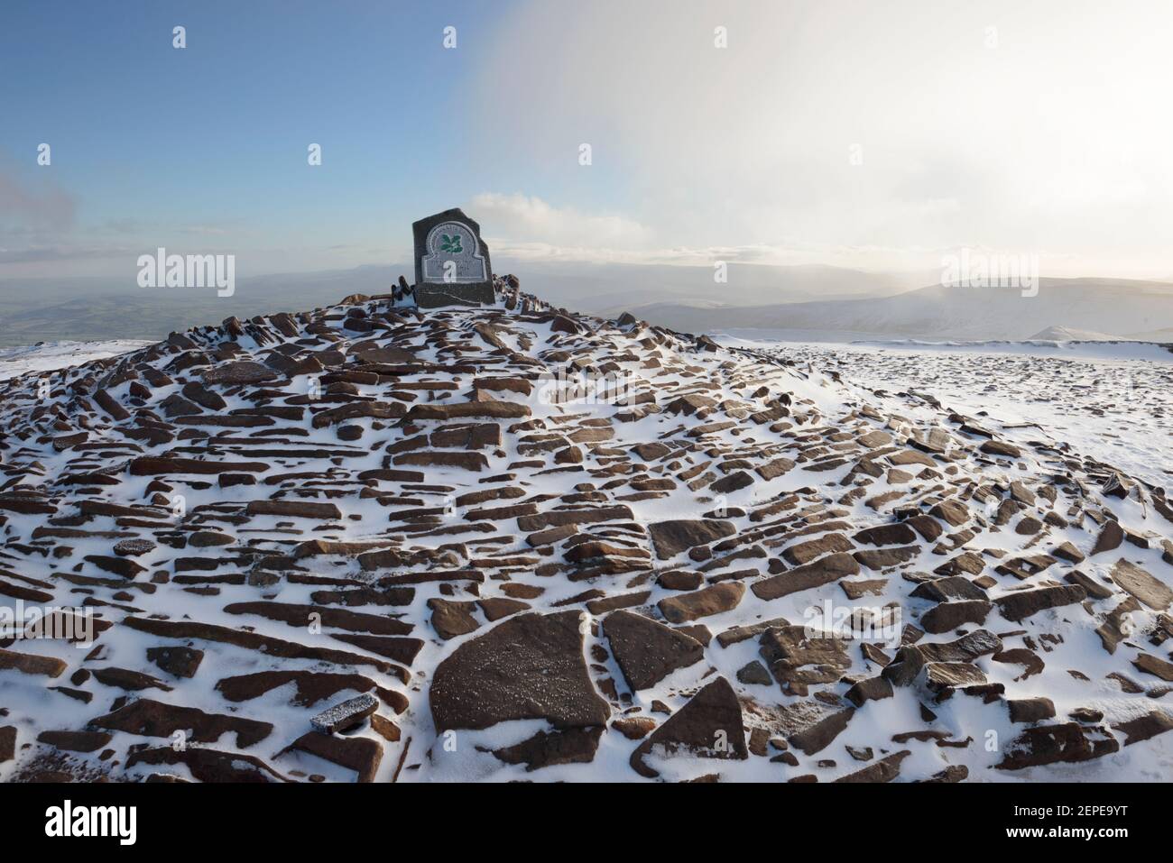 The snow covered summit cairn of Pen Y Fan in the Brecon Beacons, Wales. Stock Photo