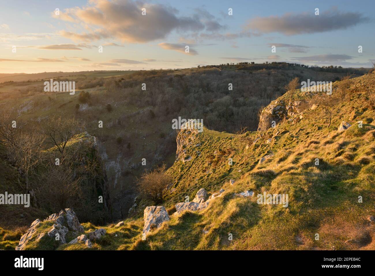 Evening sun lighting the rocky outcrops of the Pinnacles at Cheddar Gorge, Somerset. Stock Photo