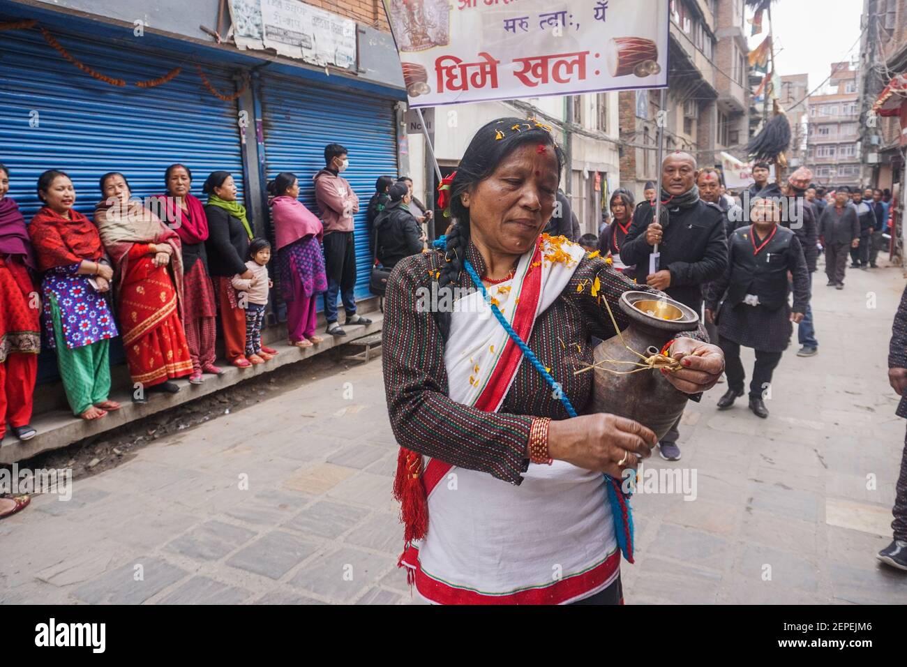 A Woman From Newar Community Dressed In Traditional Attire Participates In A Parade During The