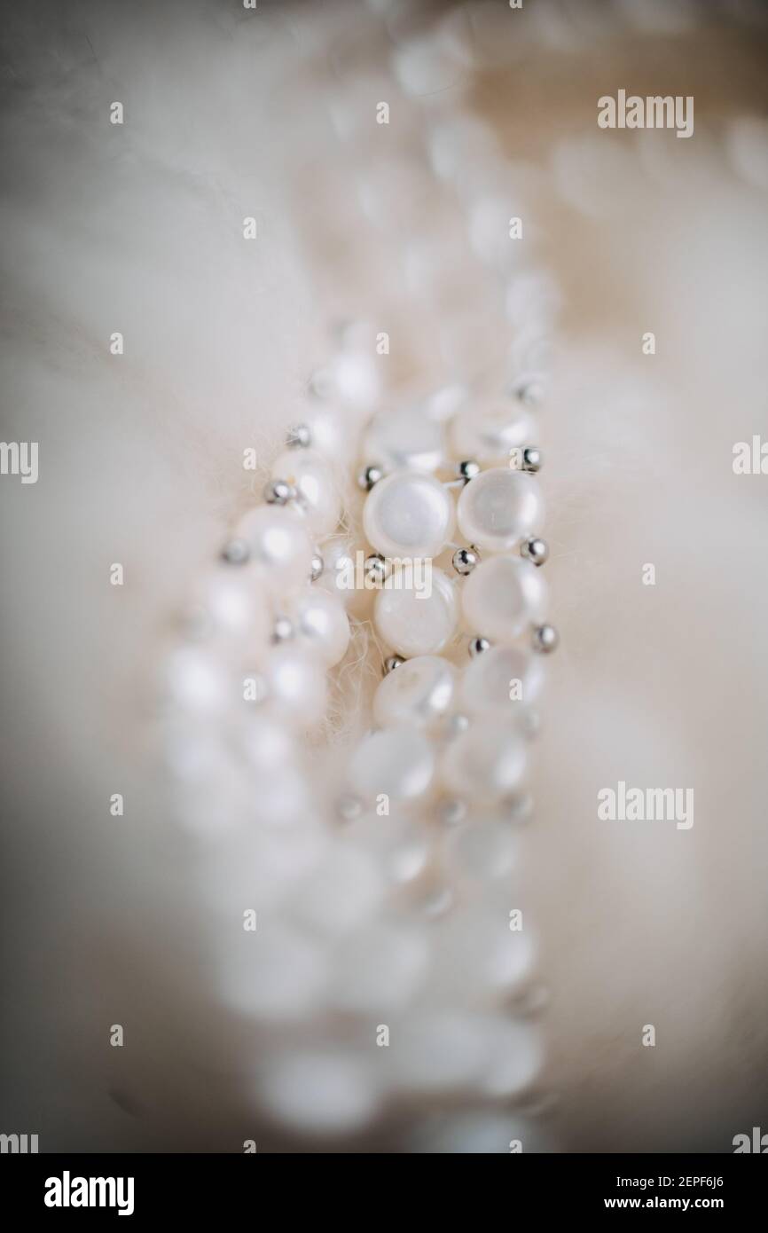 photo of a bride's pearl necklace on fur Stock Photo