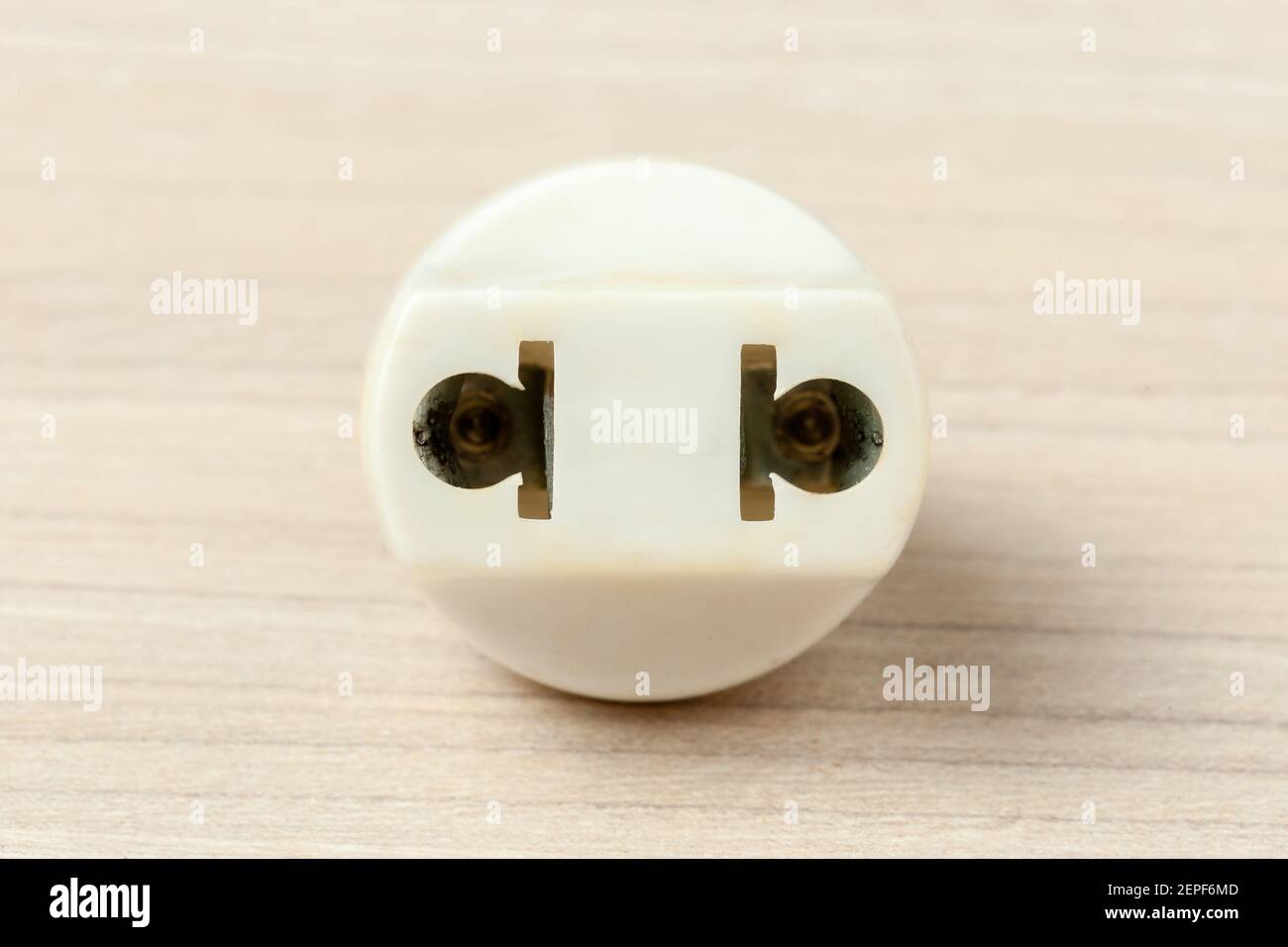 universal electrical power plug adapter at wooden background Stock Photo