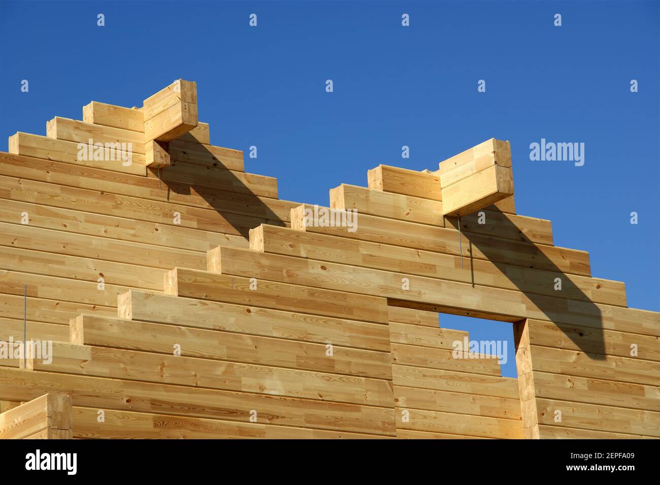 Abstract composition of new house frame construction and deep blue ...
