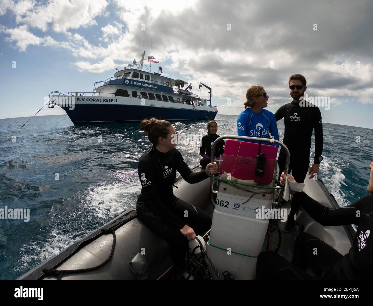 Ross Cunning, right, and his dive team depart from the Coral Reef II