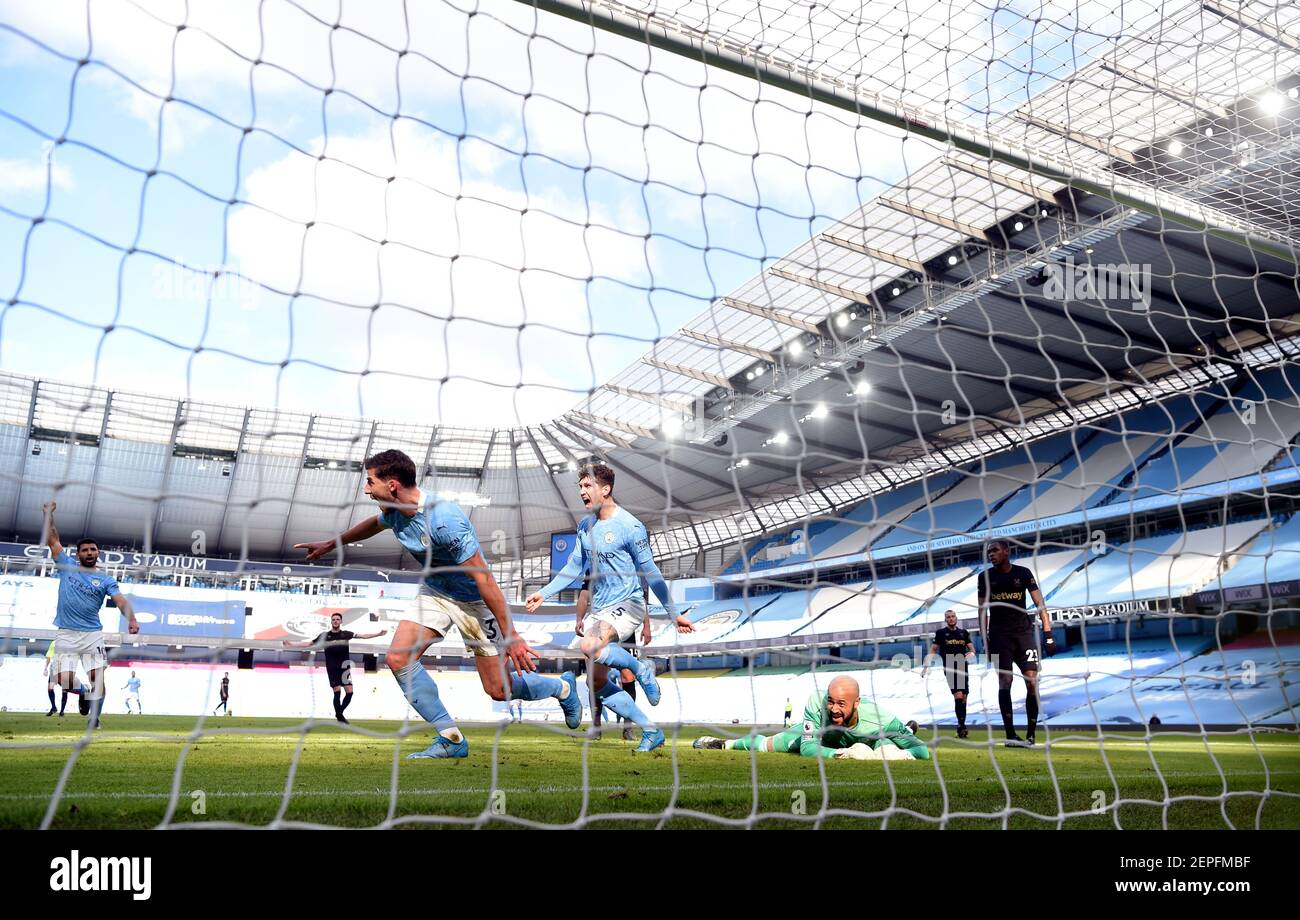 Manchester City's Ruben Dias scores the first goal of the game during the Premier League match at the Etihad Stadium, Manchester. Picture date: Saturday February 27, 2021. Stock Photo