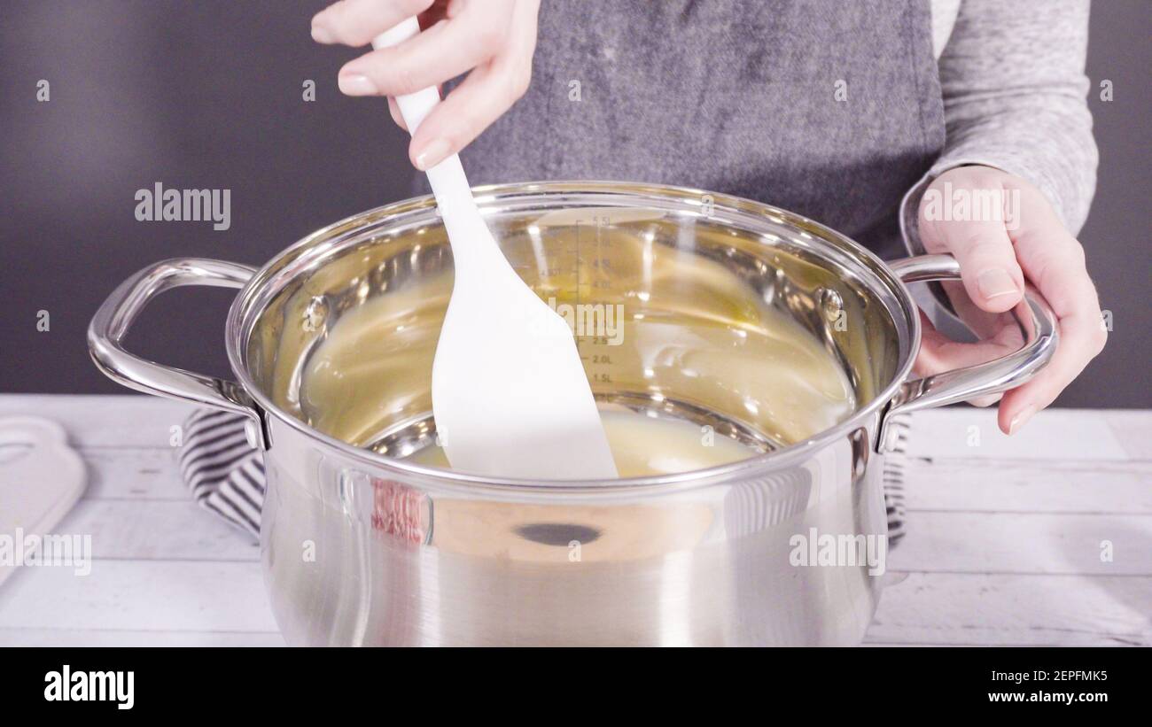 Step by step. Melting white chocolate chips in the cooking pot to make