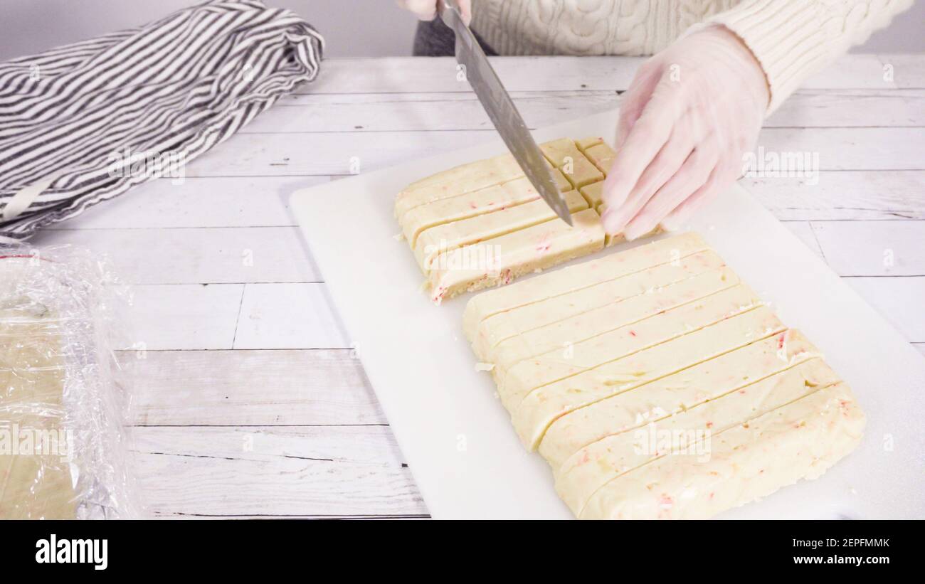 Step by step. Cutting homemade candy cane fudge on a white cutting Step by step. Cutting homemade candy cane fudge on a white cutting