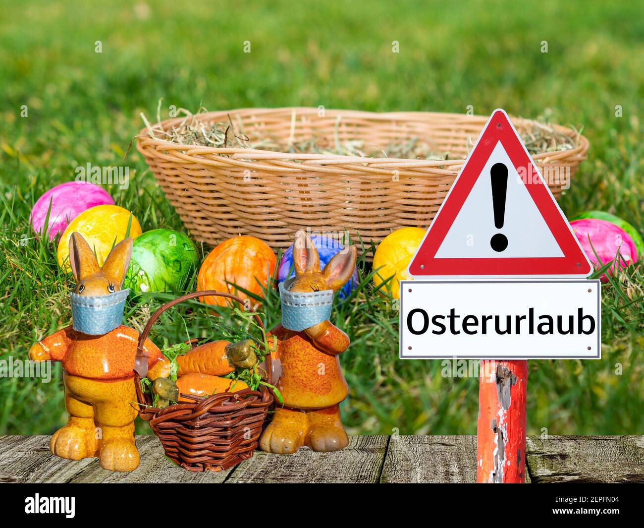 Easter holiday warning sign with Easter bunny and basket in german Easter holiday warning sign with Easter bunny and basket in german